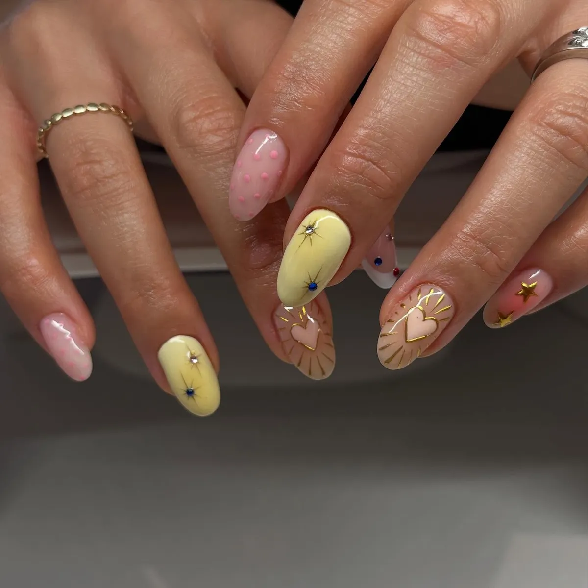 Pastel yellow with gold accents, hearts, and mixed textures