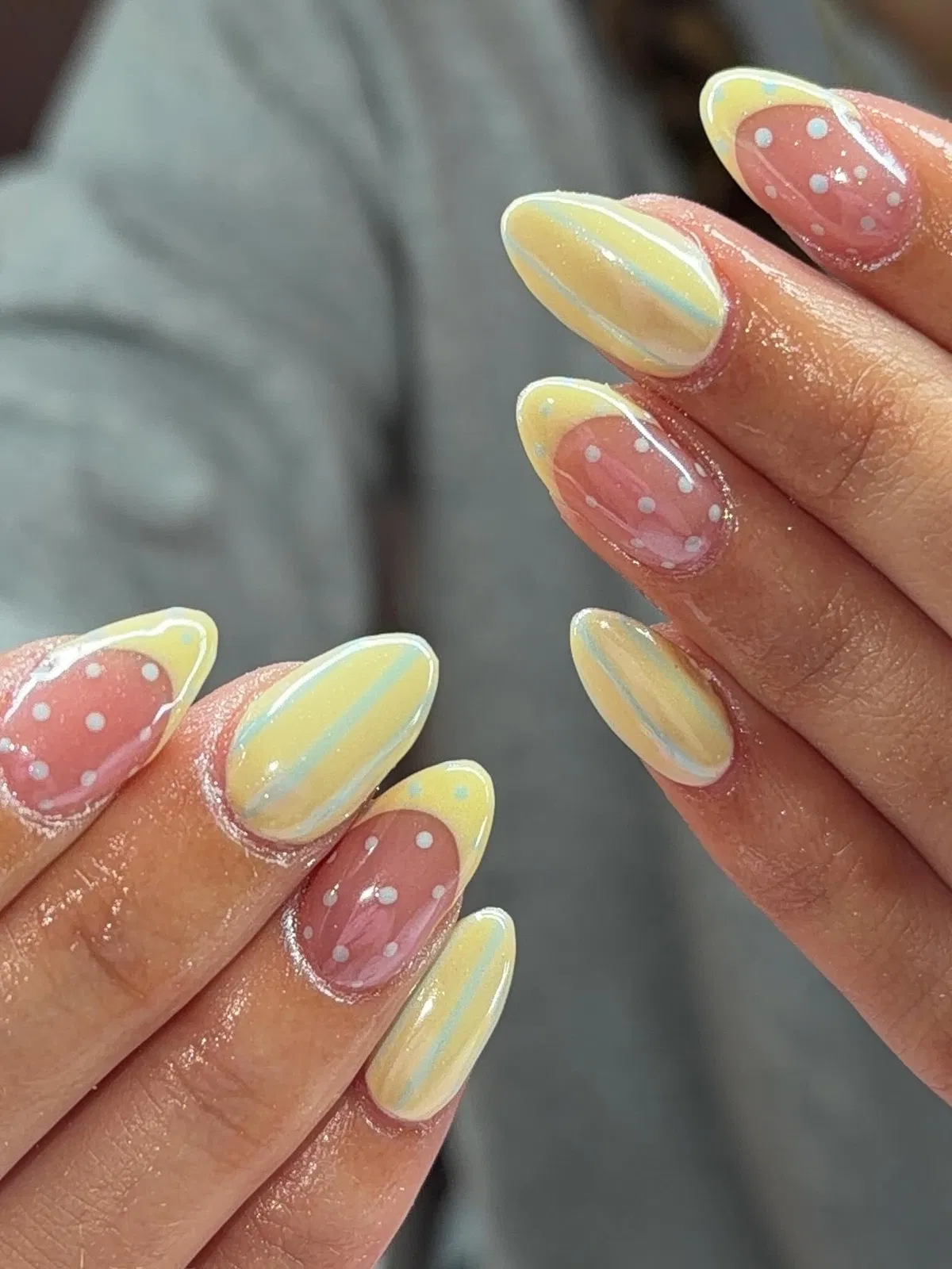 Pastel yellow tips with polka dots and soft blue striping