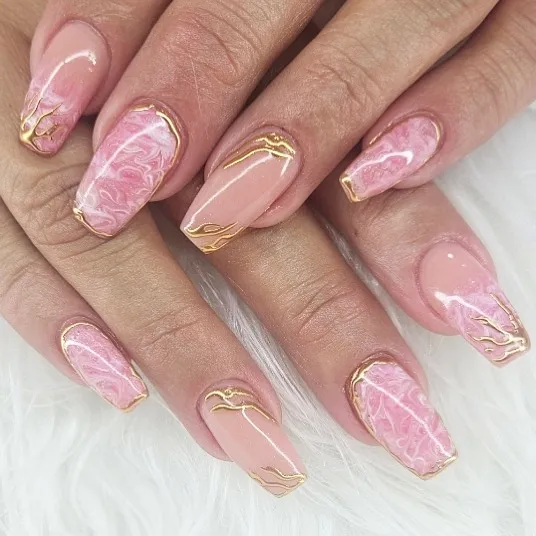 Soft pink marble squares with thin gold line accents