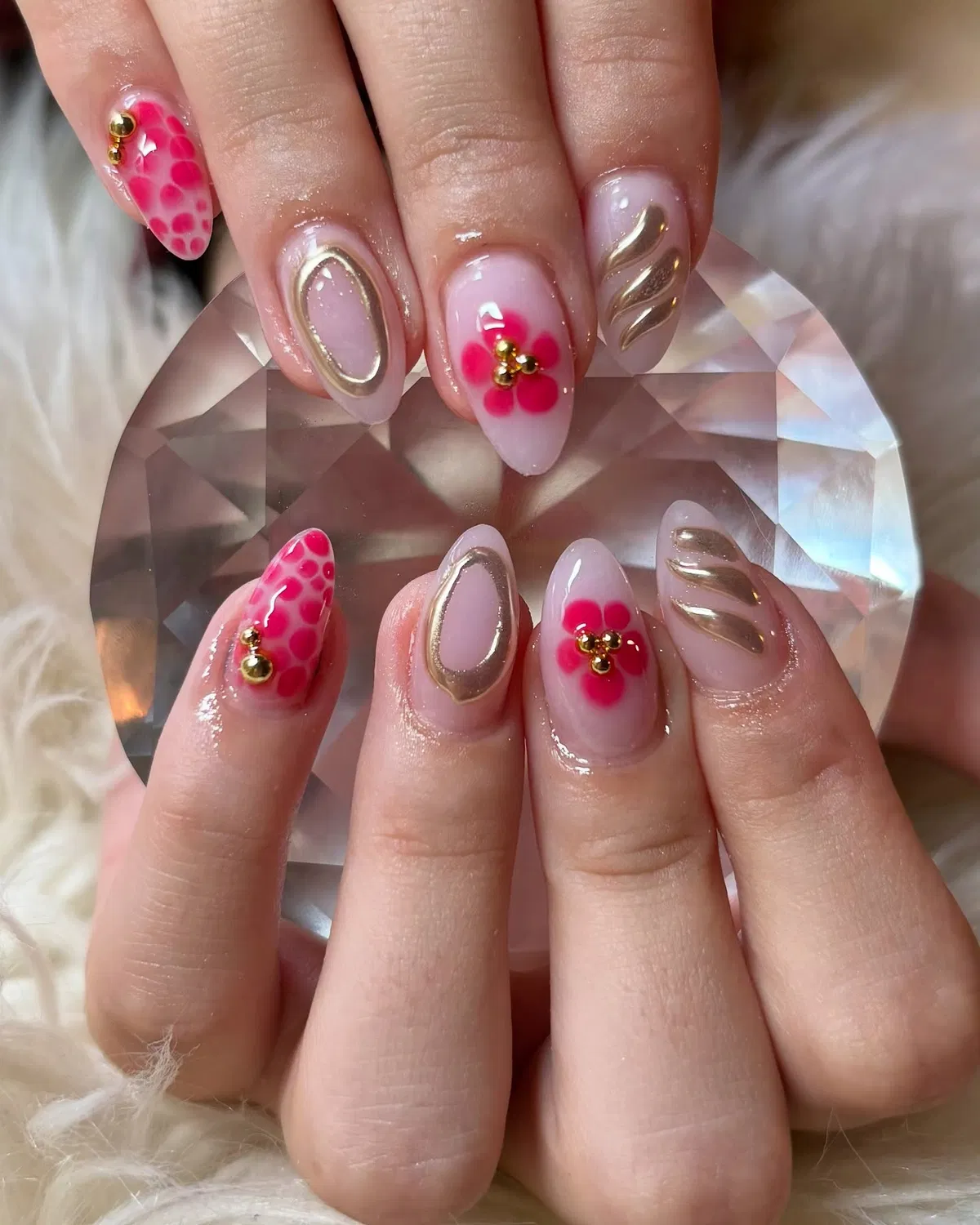 Pink florals with raised gold accents on a sheer base