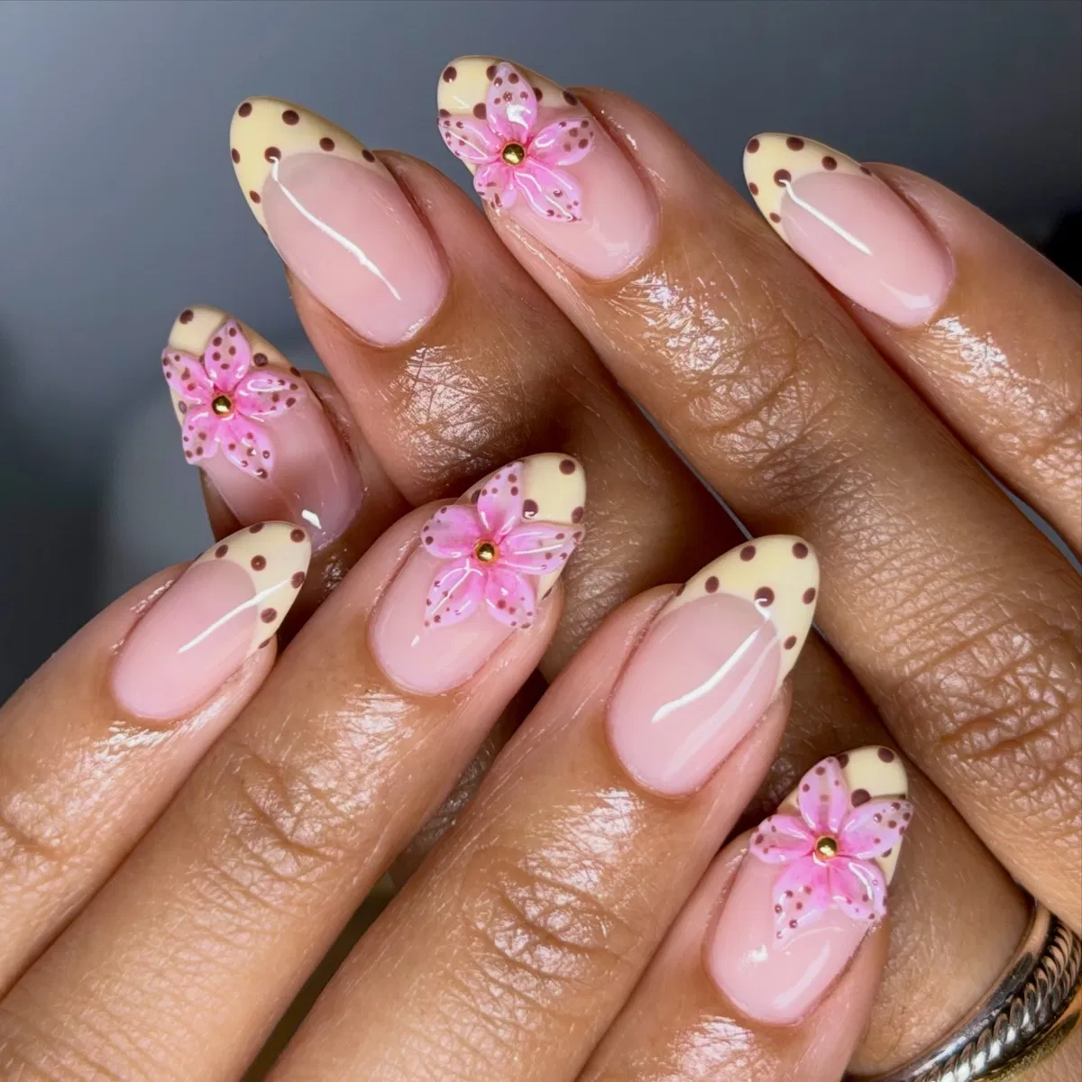 Polka-dot yellow French tips with raised pink flowers