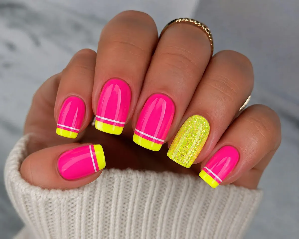 Neon French tips with a sparkly yellow accent