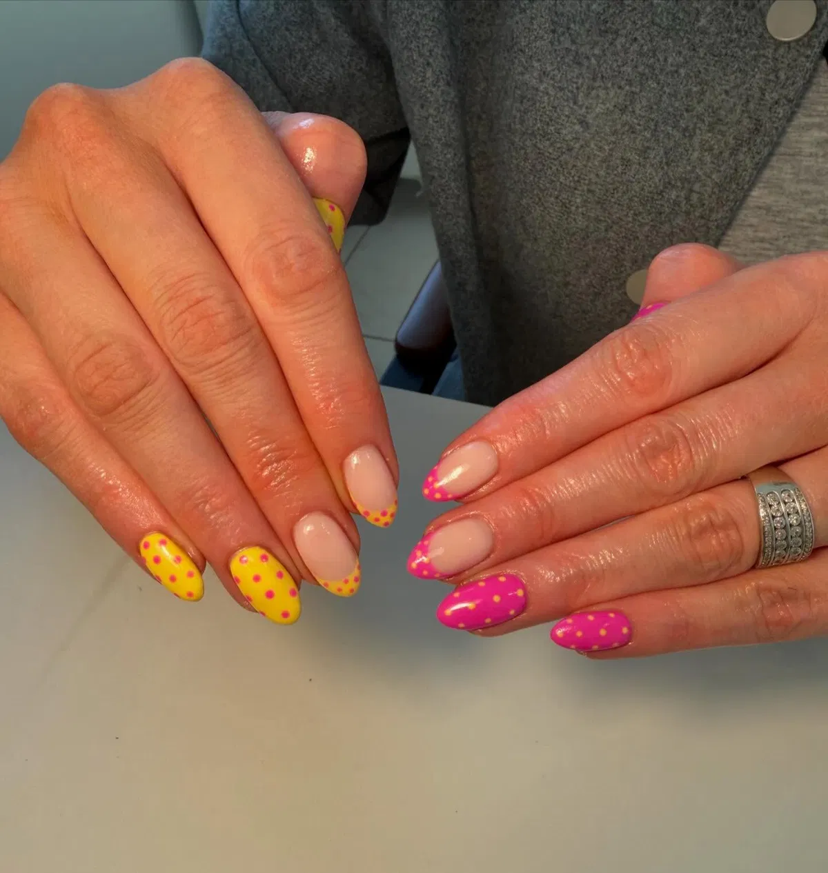 Two-tone polka dots with nude-and-pink dotted French tips