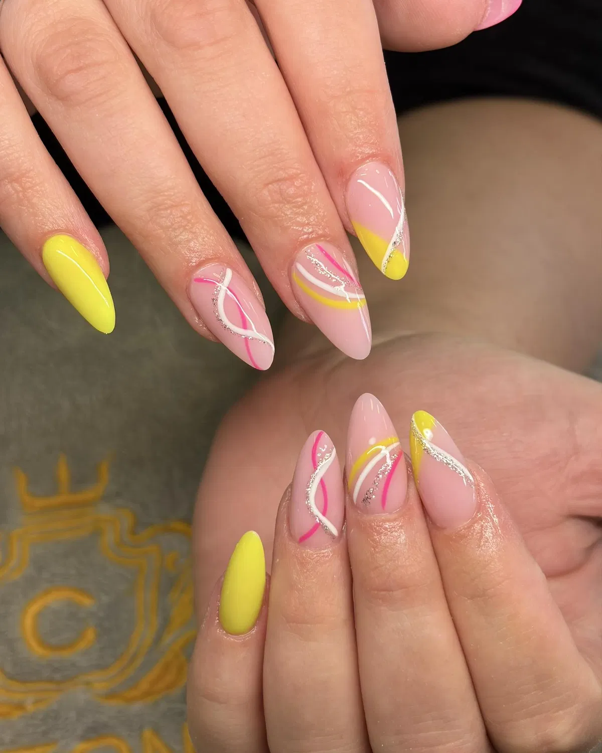 Neon yellow solids with curved pink-white-yellow line art