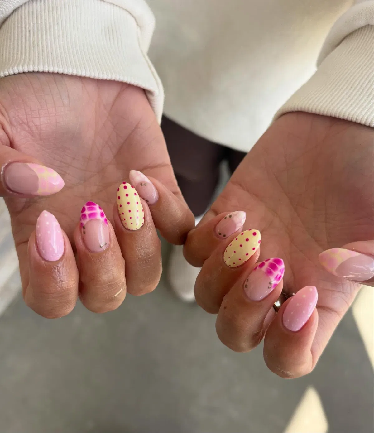 Soft pink base with polka-dot yellow and patterned pink accents