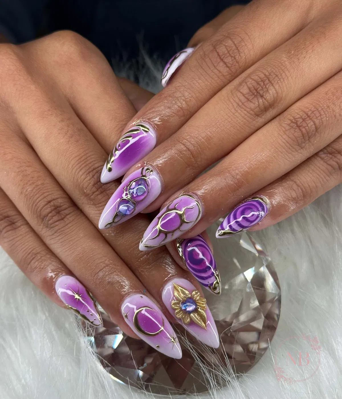 Stiletto purple marbling with raised gold outlines and 3D gems