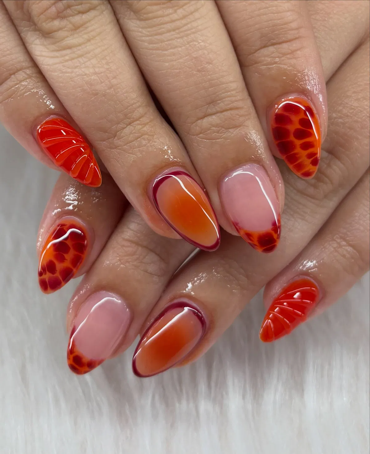 Orange-leaning aura gradients with textured bright-orange accents