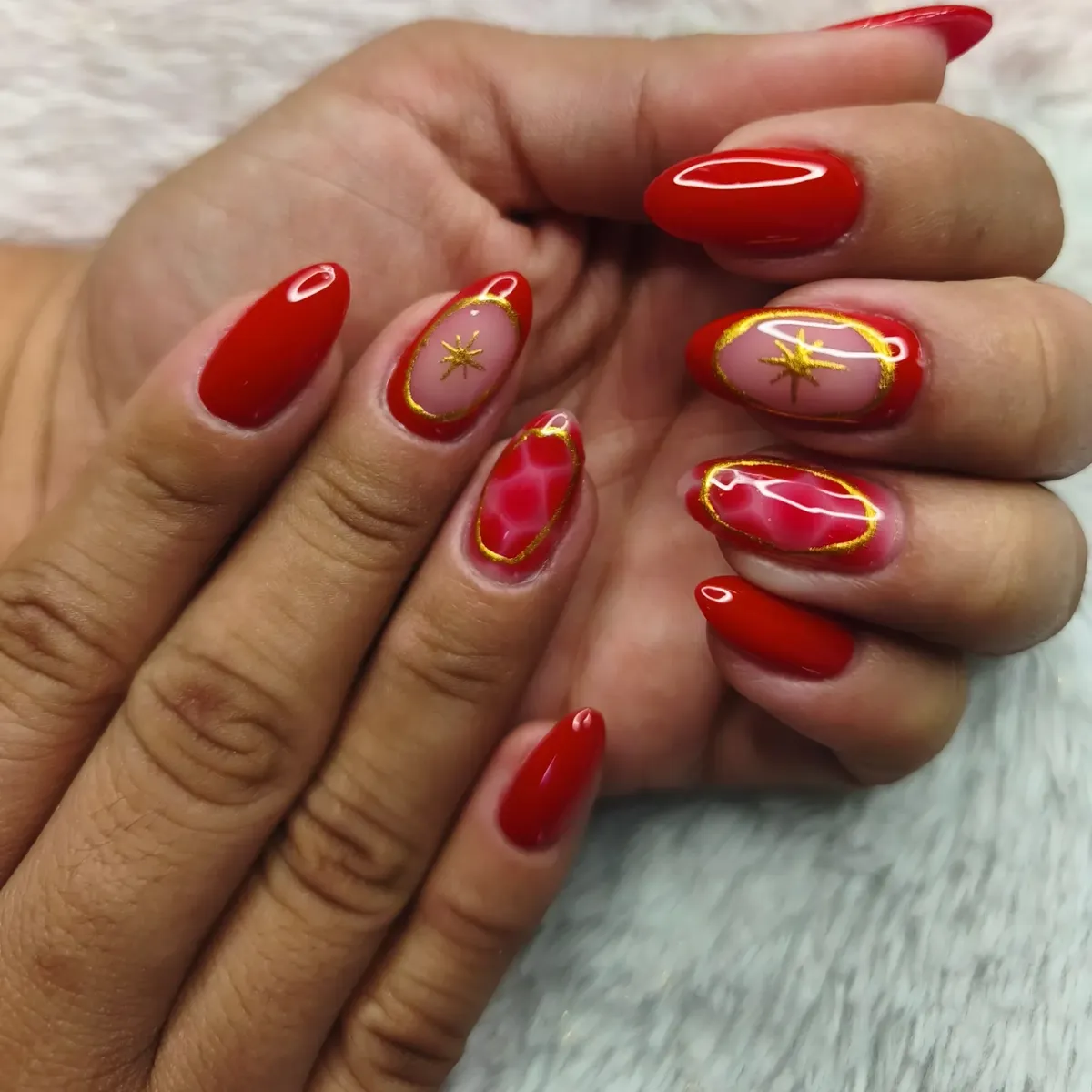 Red framed aura accents with gold outlines and starbursts