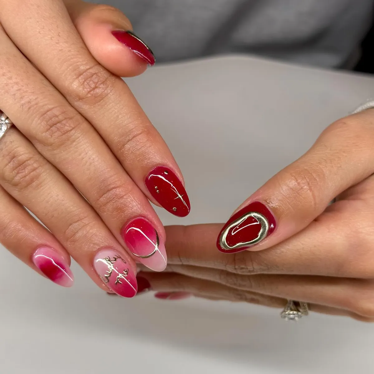 Pink-red aura gradients with metallic outlines and small studs