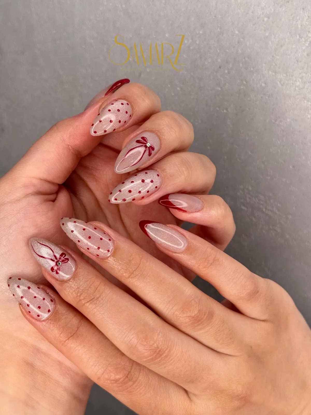 Sheer pearly base with red dots, tip outlines, and bow line art