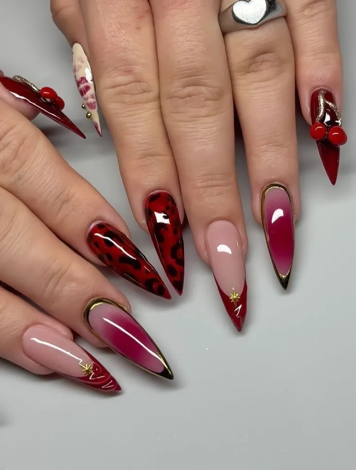 Stiletto reds with leopard print and gold-outlined ombrรฉ