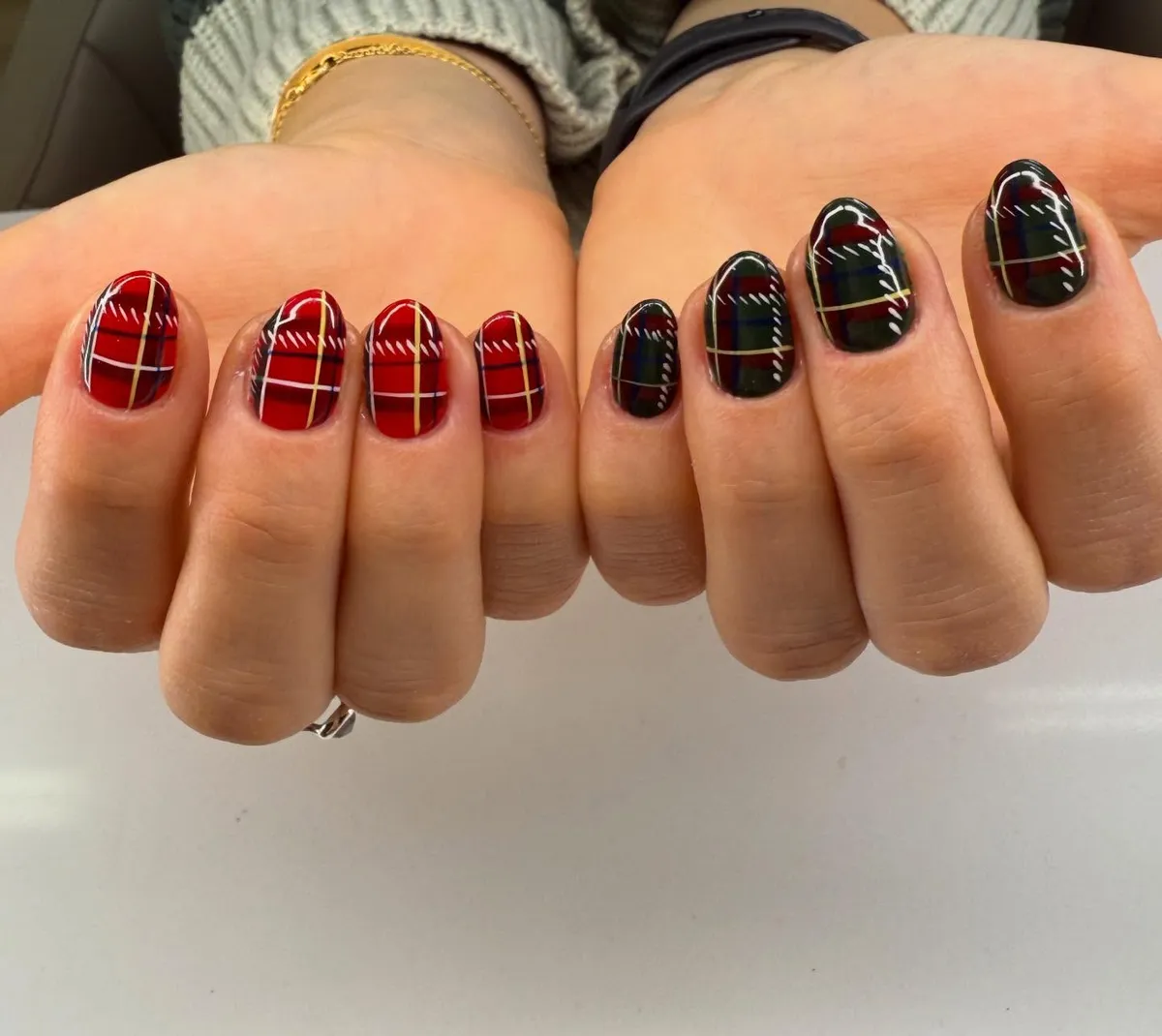Red-and-green plaid set with stitch-like white accents