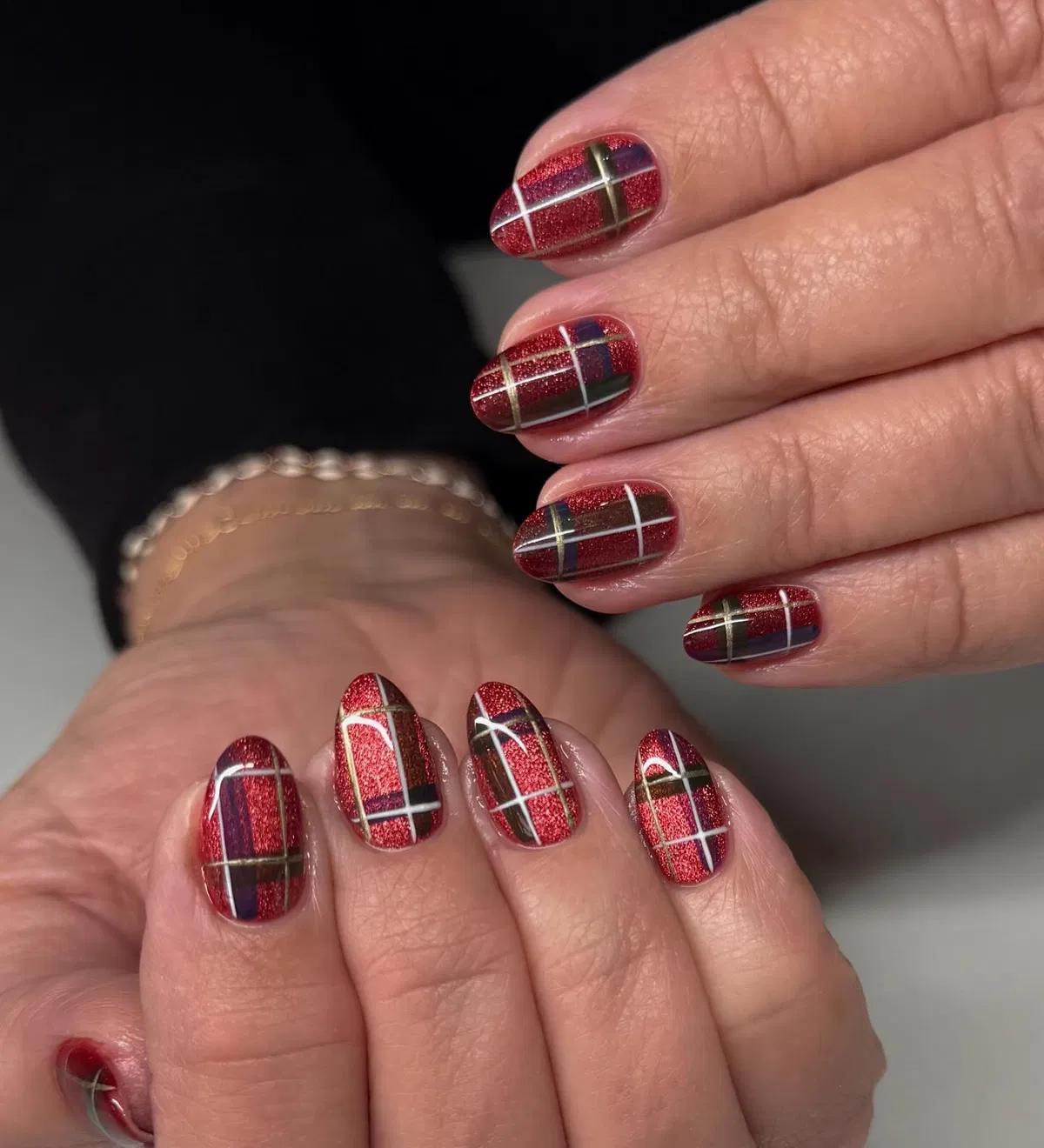 Shimmery red plaid with navy/green blocks and gold striping