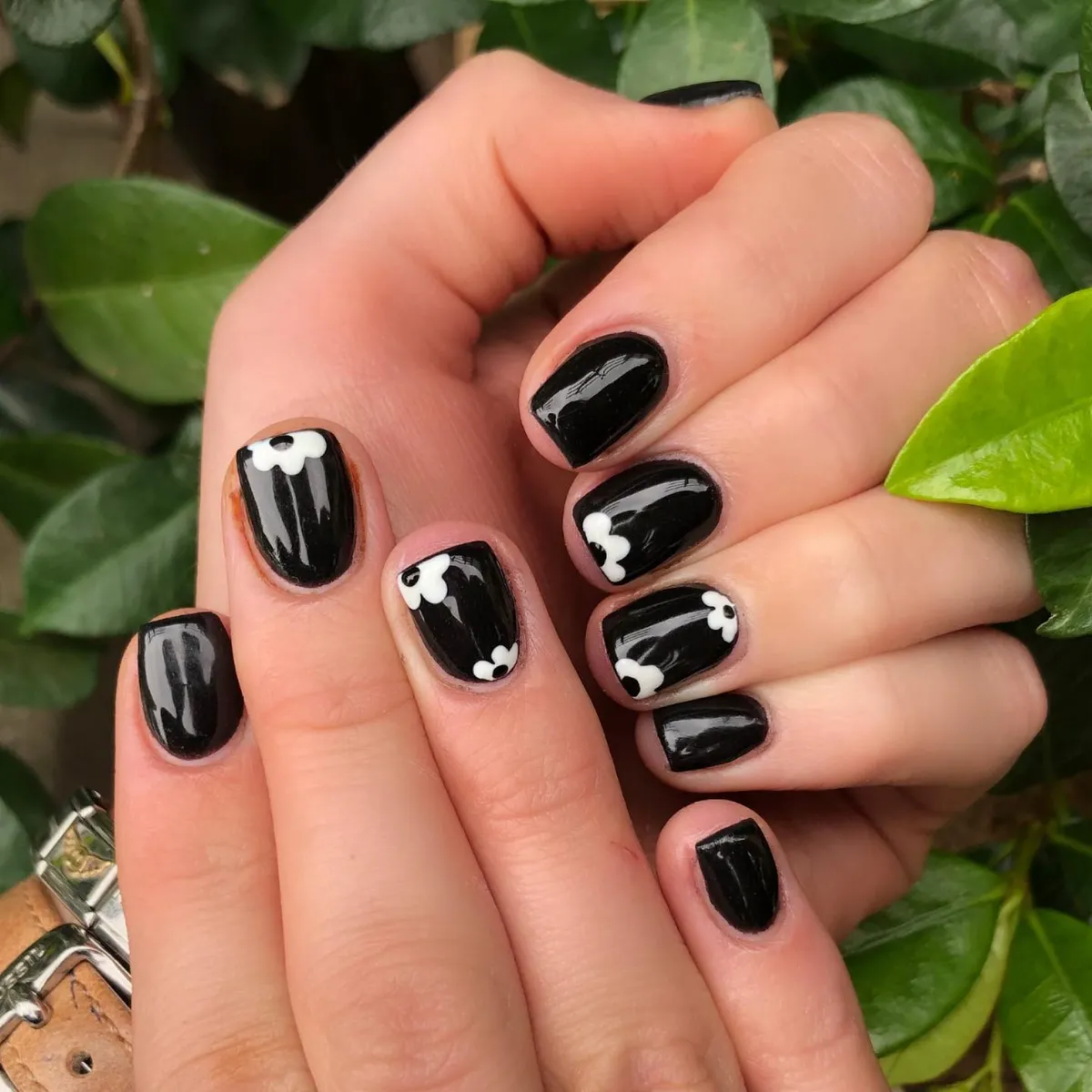 Glossy black with tiny white corner flowers