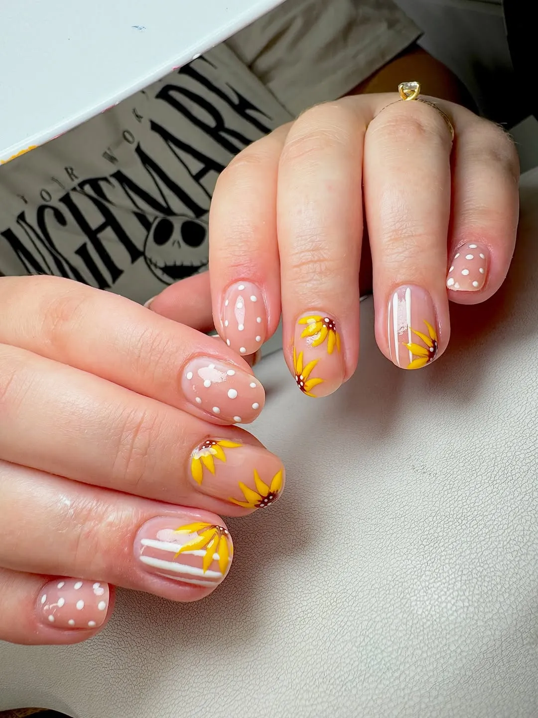 Nude base with yellow floral details, dots, and stripes