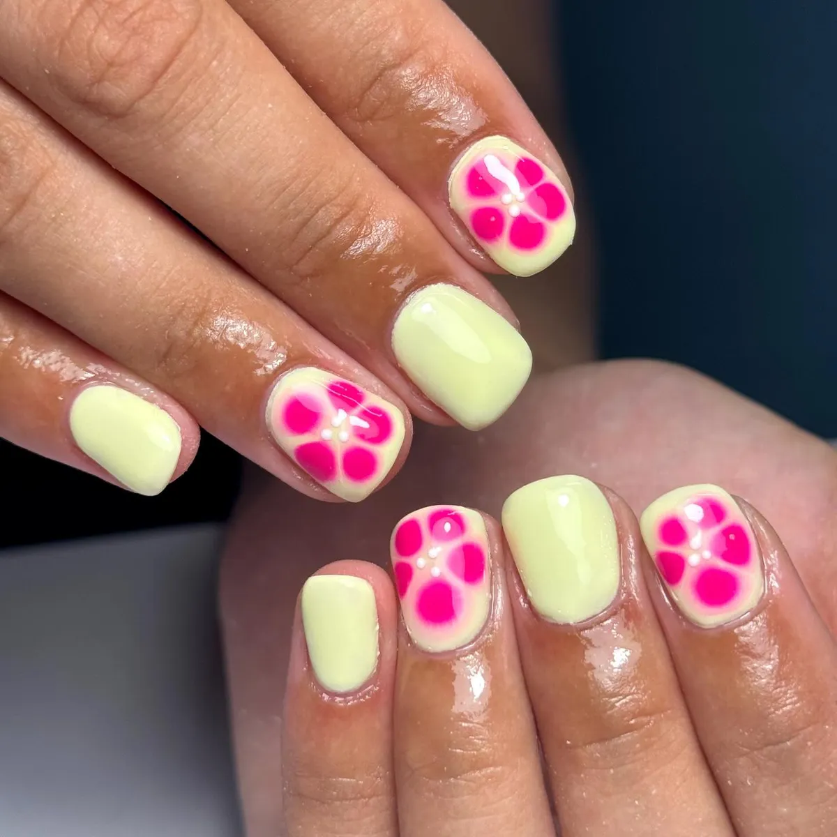 Pale yellow base with bright pink flower accents