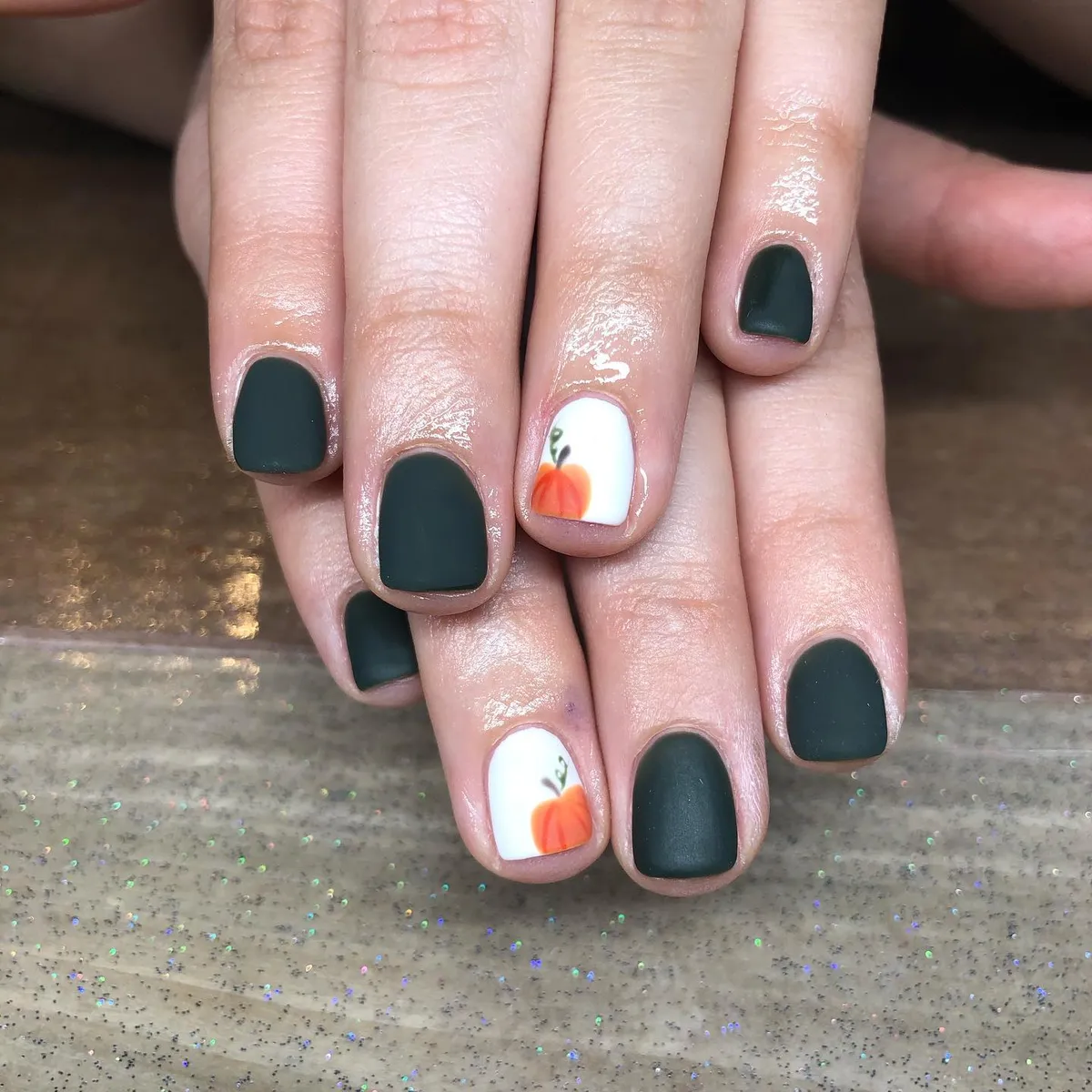 Matte dark green with white pumpkin accents