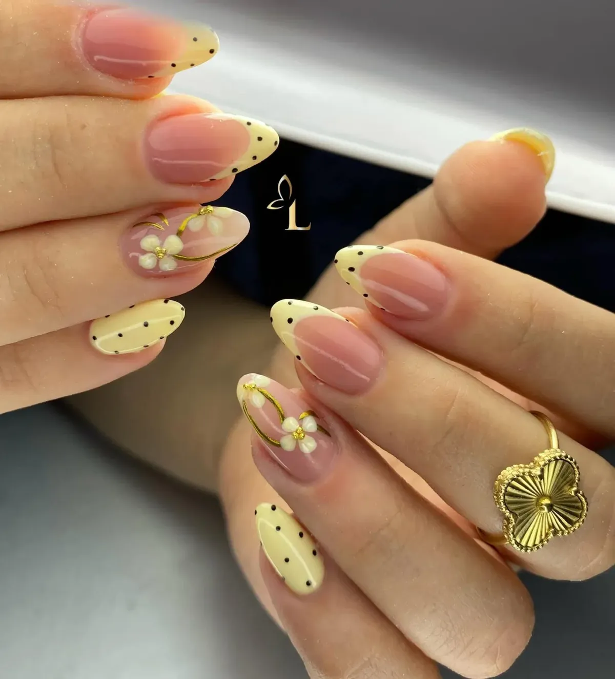 Pale yellow polka-dot tips with raised white flowers