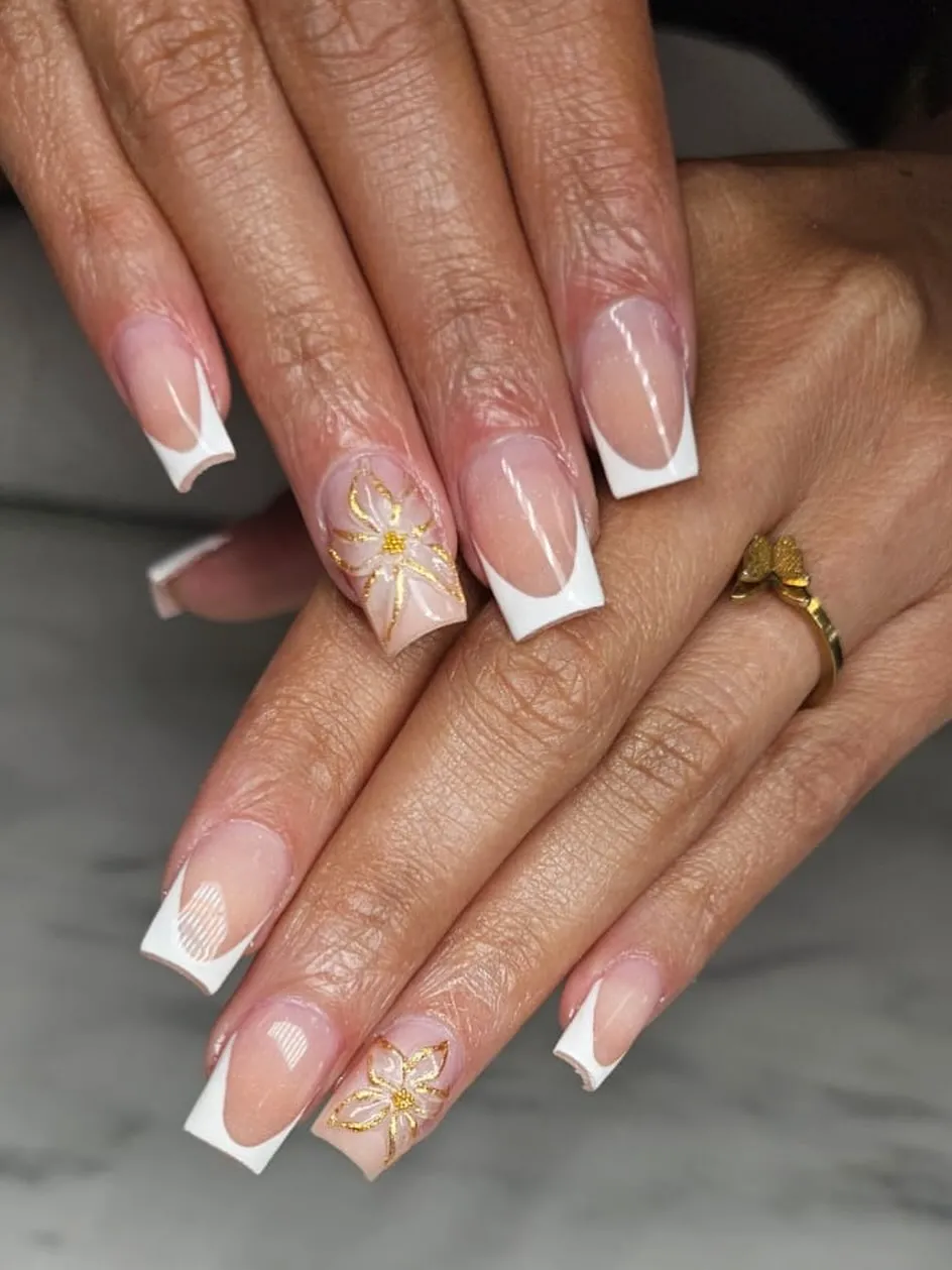 Classic white French tips with gold floral outlines