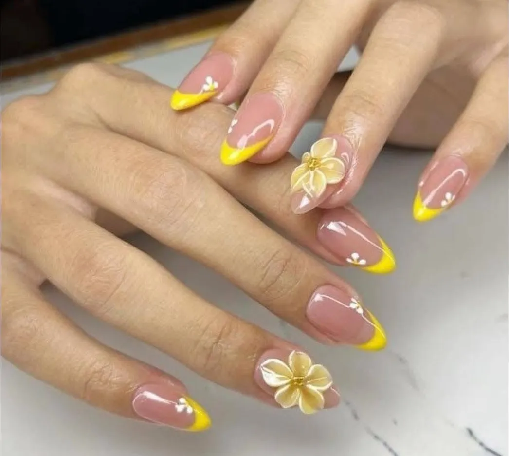 Yellow French tips with small white florals and 3D flowers