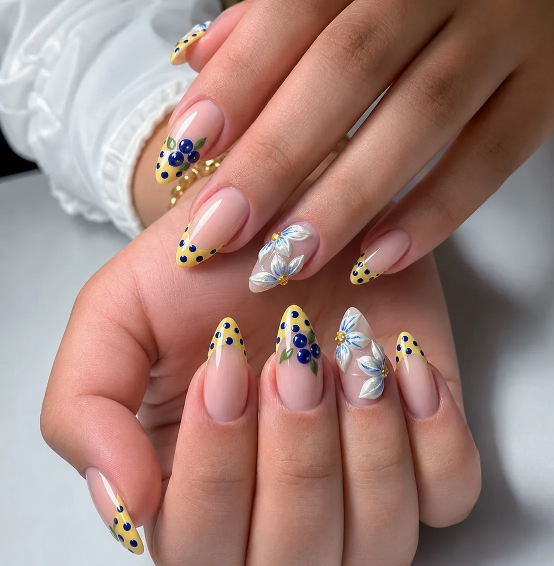 Yellow dotted tips with raised floral accents