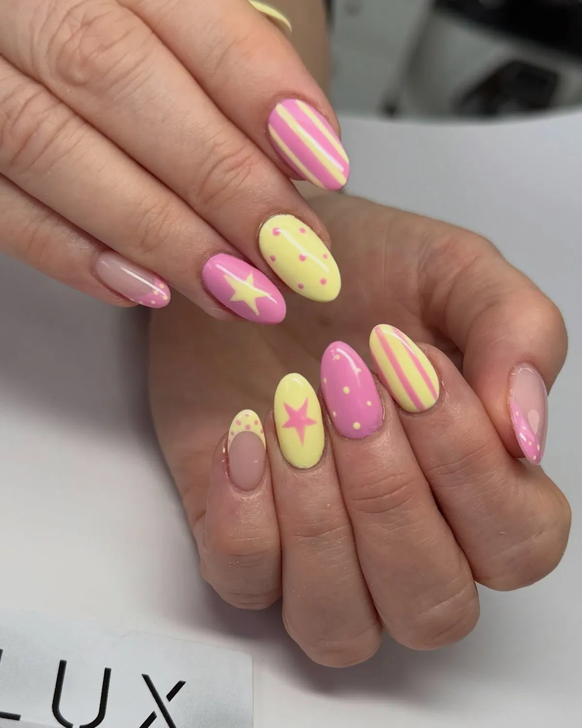 Pastel yellow and pink mix with stripes, dots, and stars