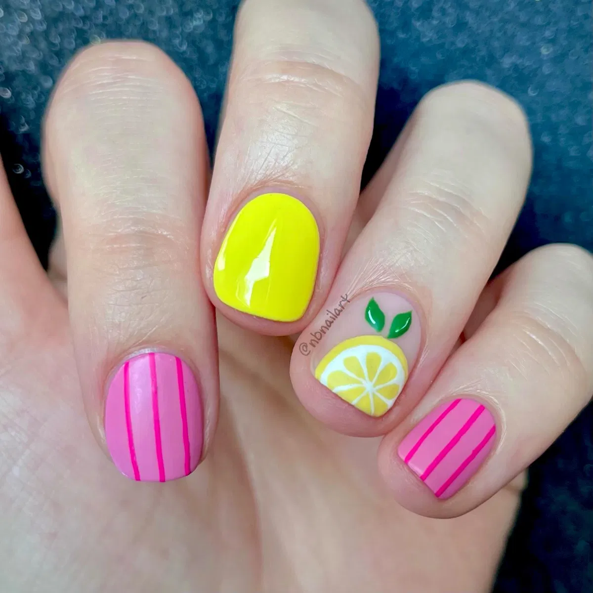 Lemon accent with pink stripes and a bright yellow nail