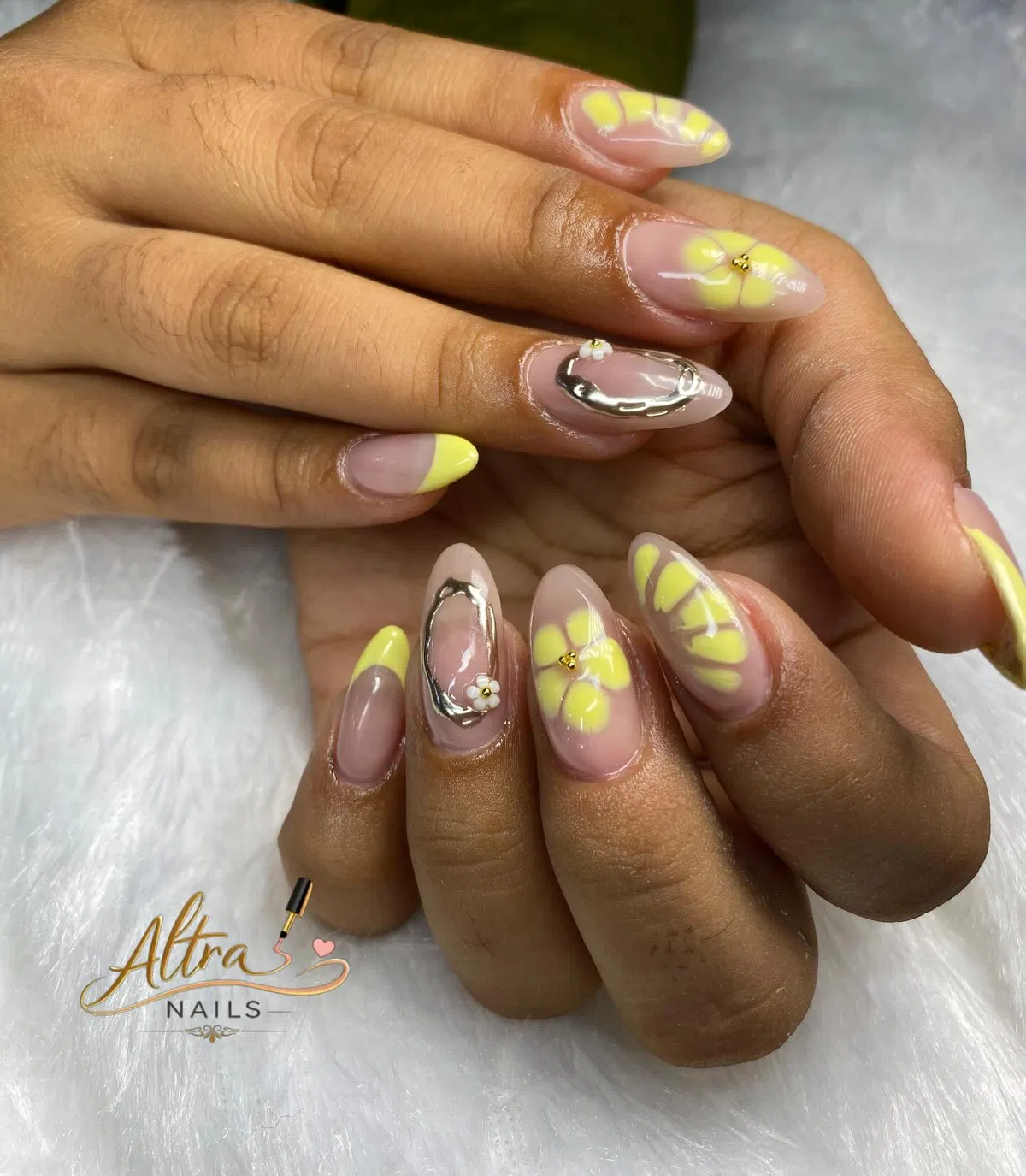 Yellow floral accents on nude base with silver frame detail