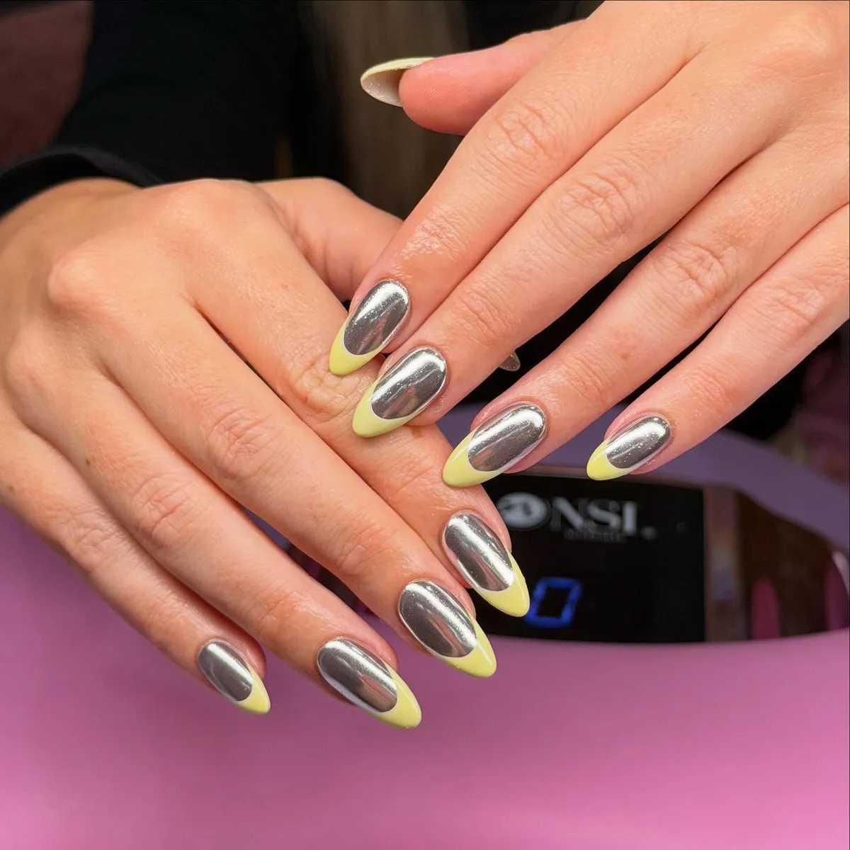 Silver mirror nails with pale yellow French tips