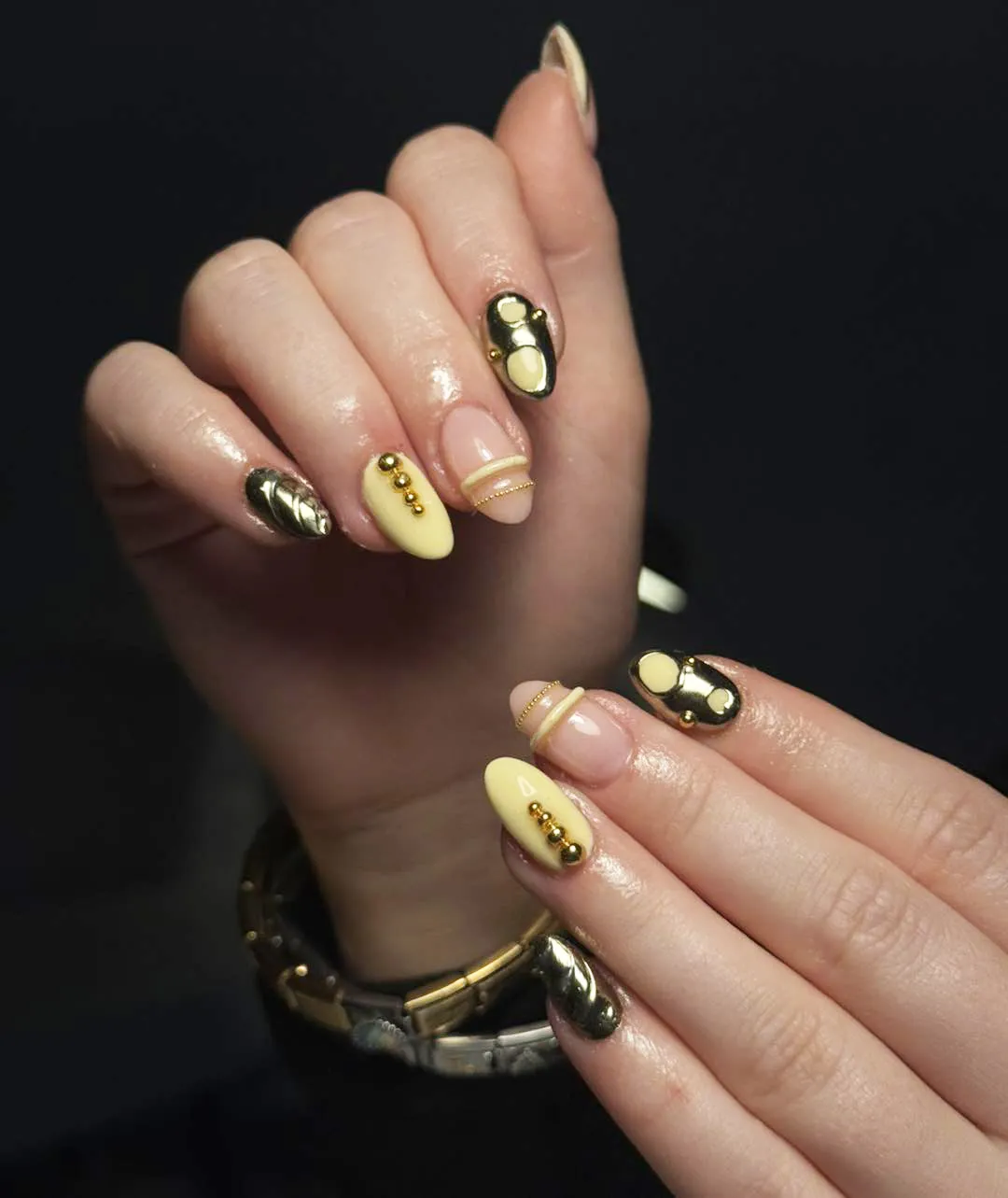 Nude and Pale Yellow Nails with Bold Raised Gold Elements