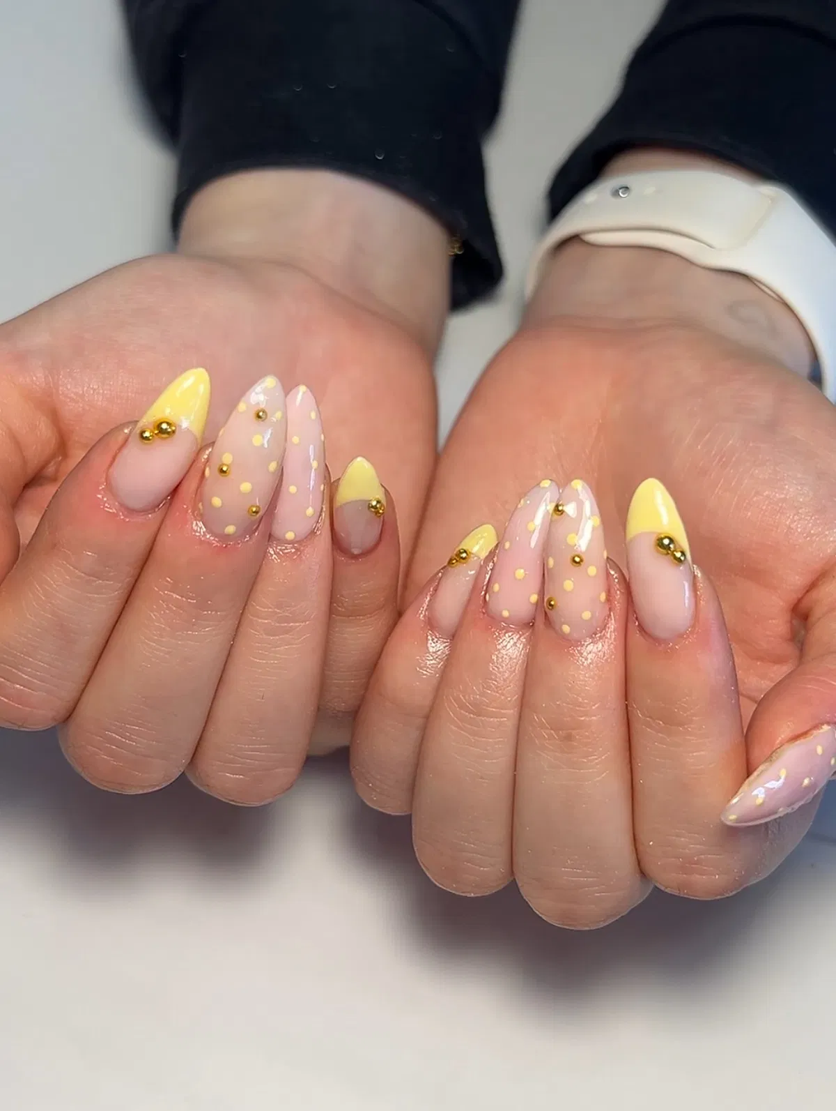 Yellow tips with polka dots and gold bead accents