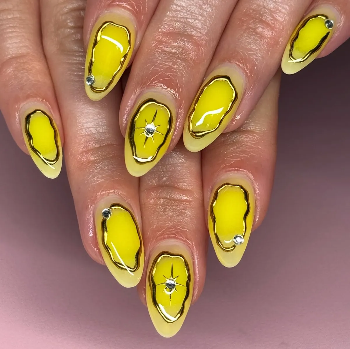 Bright yellow panels with irregular gold outlines and rhinestones