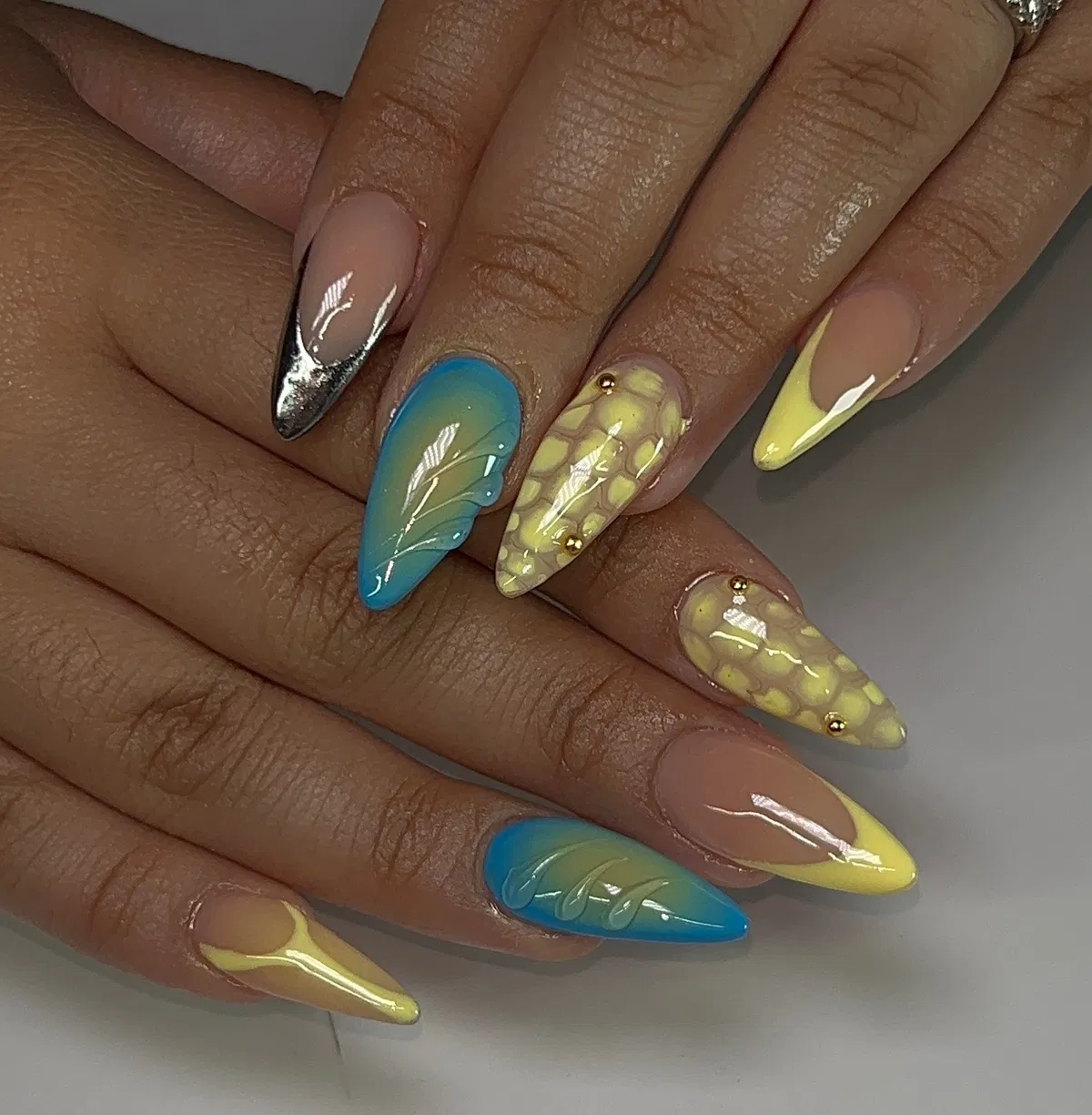 Mixed metallic tips, blue gradient leaves, and yellow honeycomb accents
