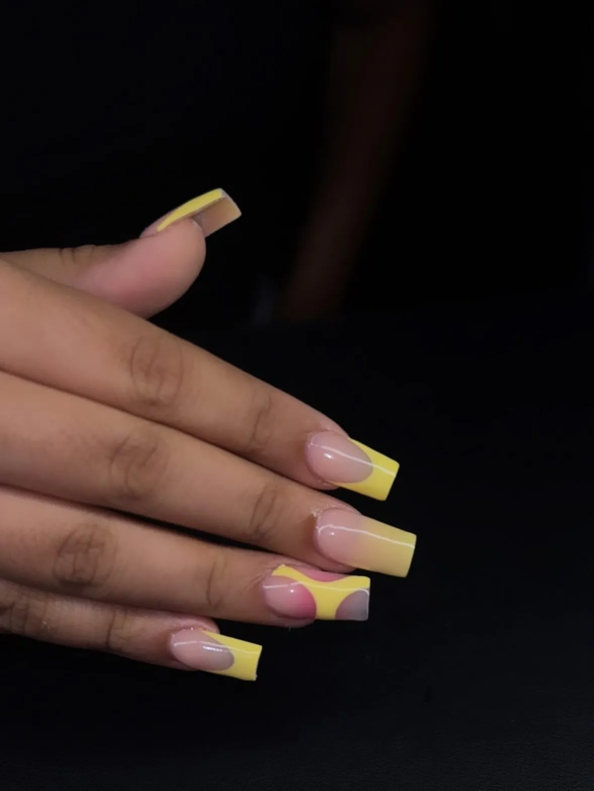 Long square yellow French tips with pink-and-yellow color blocking