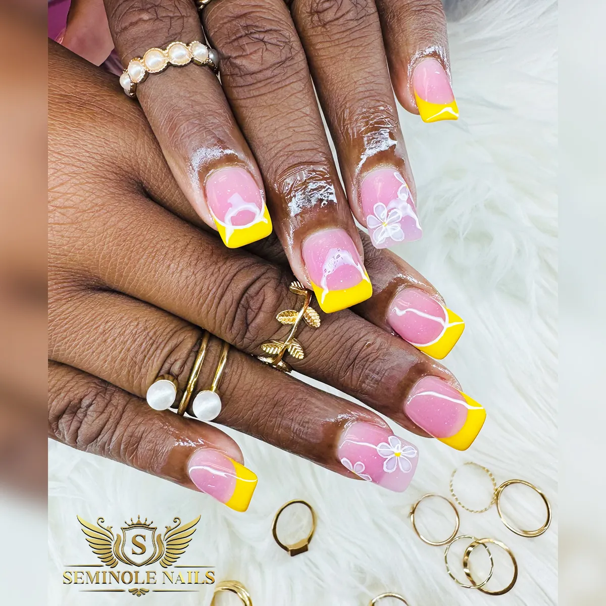 Square yellow French tips with white linework and flowers