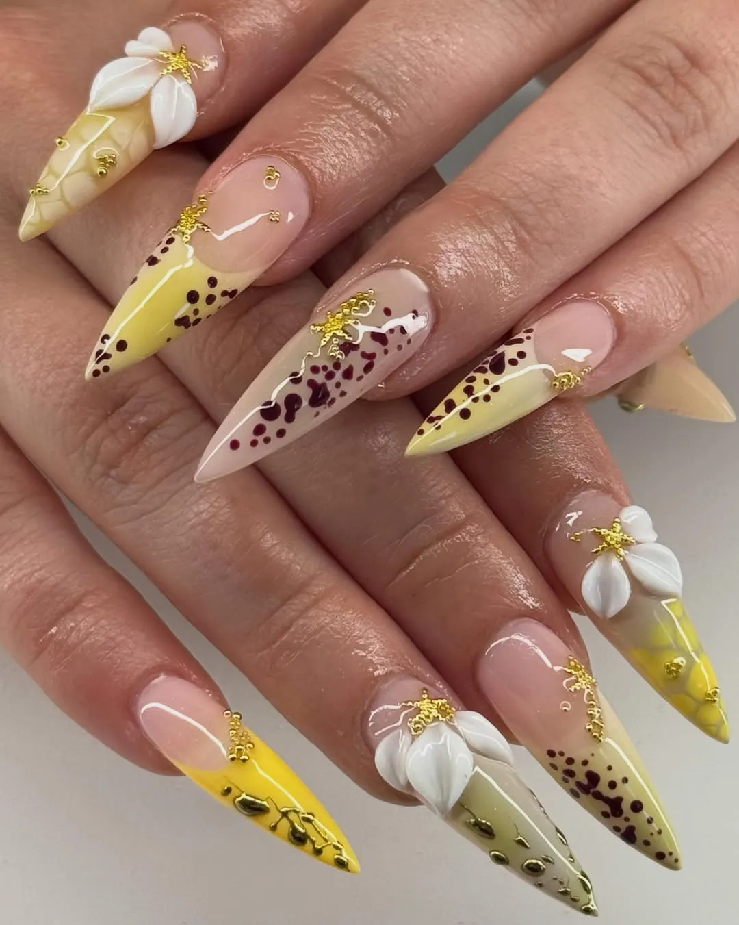 Stiletto yellow gradients with brown speckles and 3D white flowers