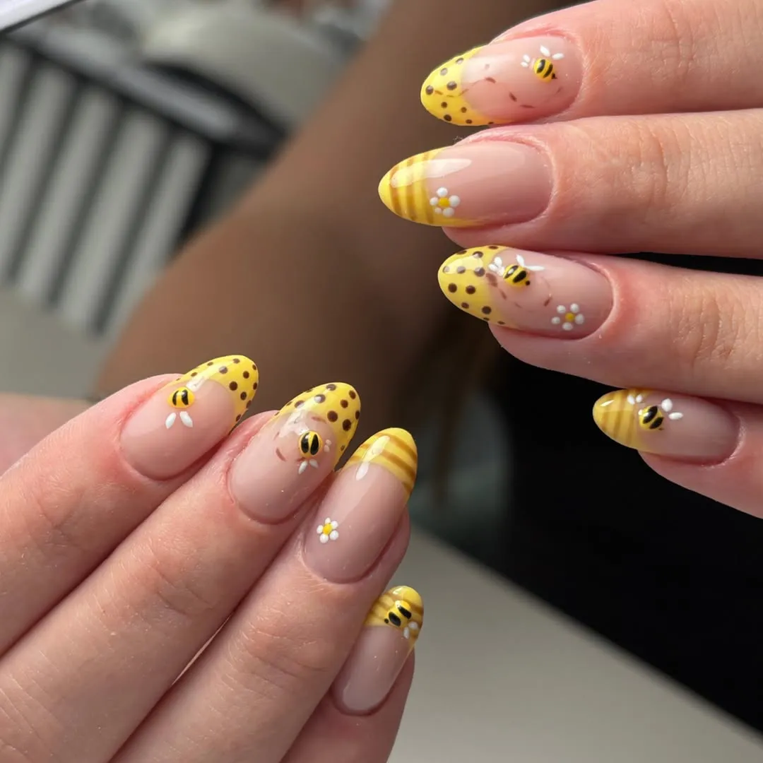 Yellow patterned tips with tiny bees and daisies