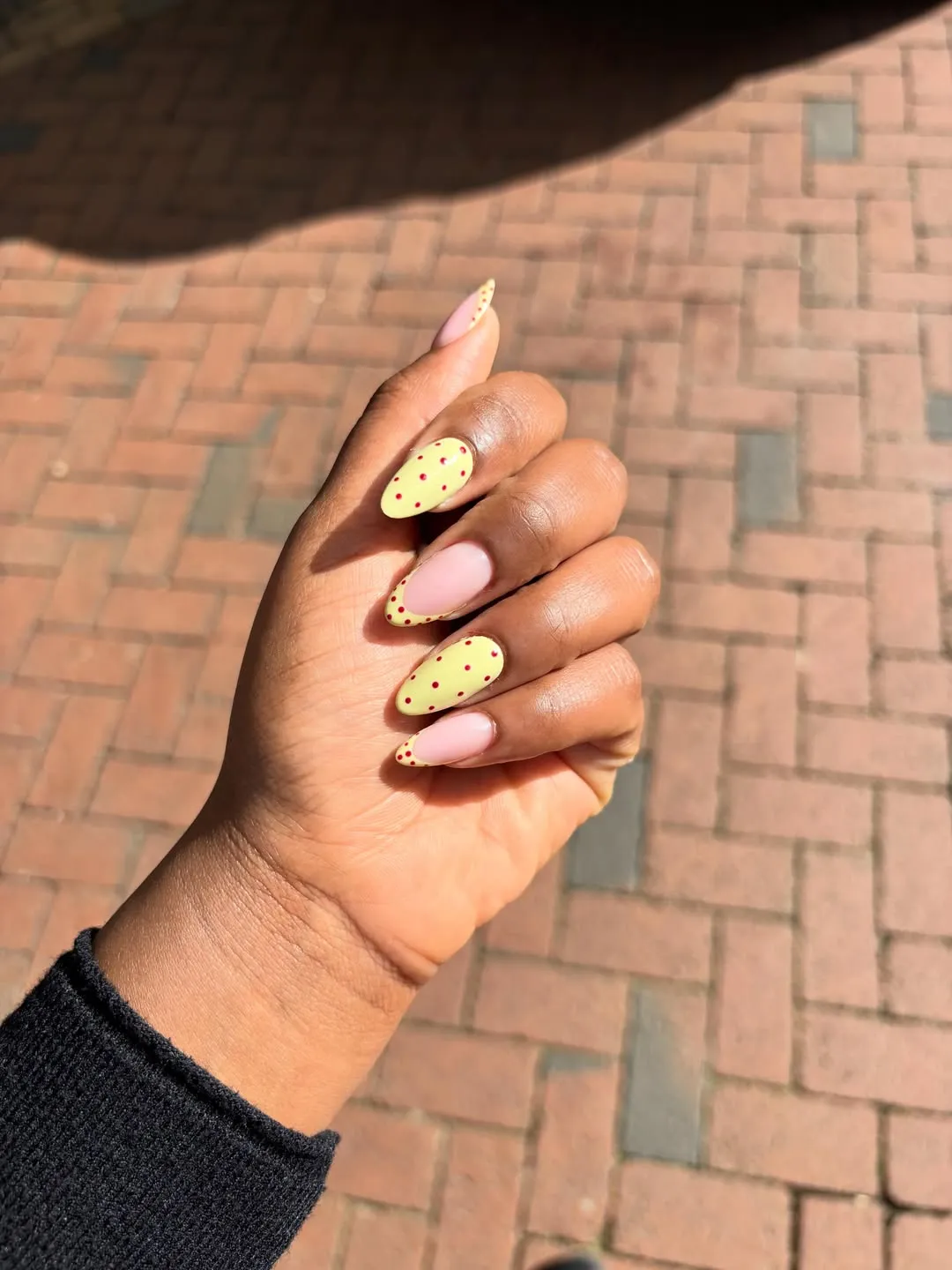Pale yellow and nude with red polka-dot accents