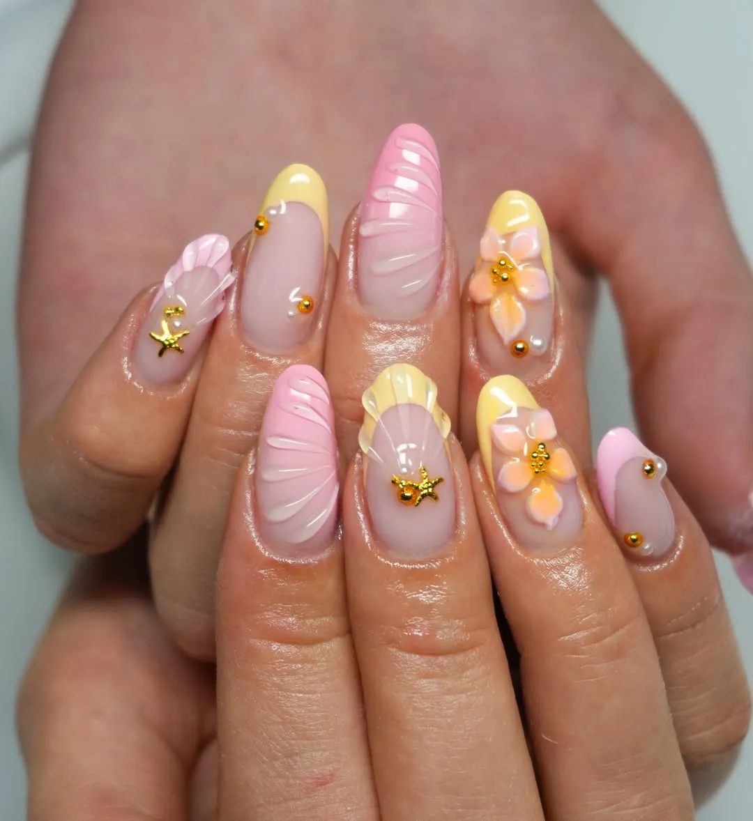 Soft pink and yellow with textured lines and starfish charms