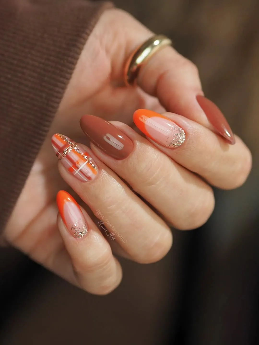 Orange French Tips with Gold Glitter Gradient and Plaid Accent
