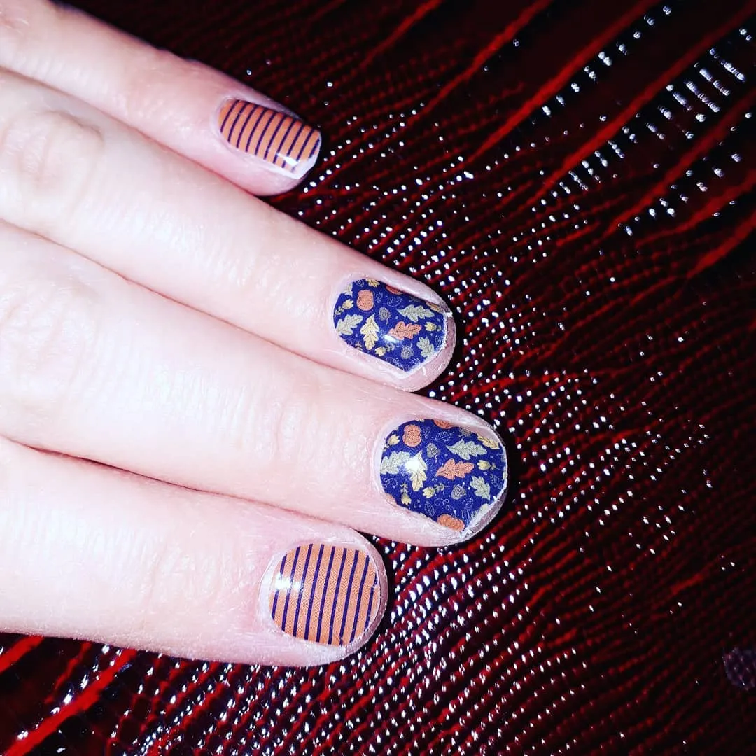 Navy leaf pattern paired with tan-and-navy stripes