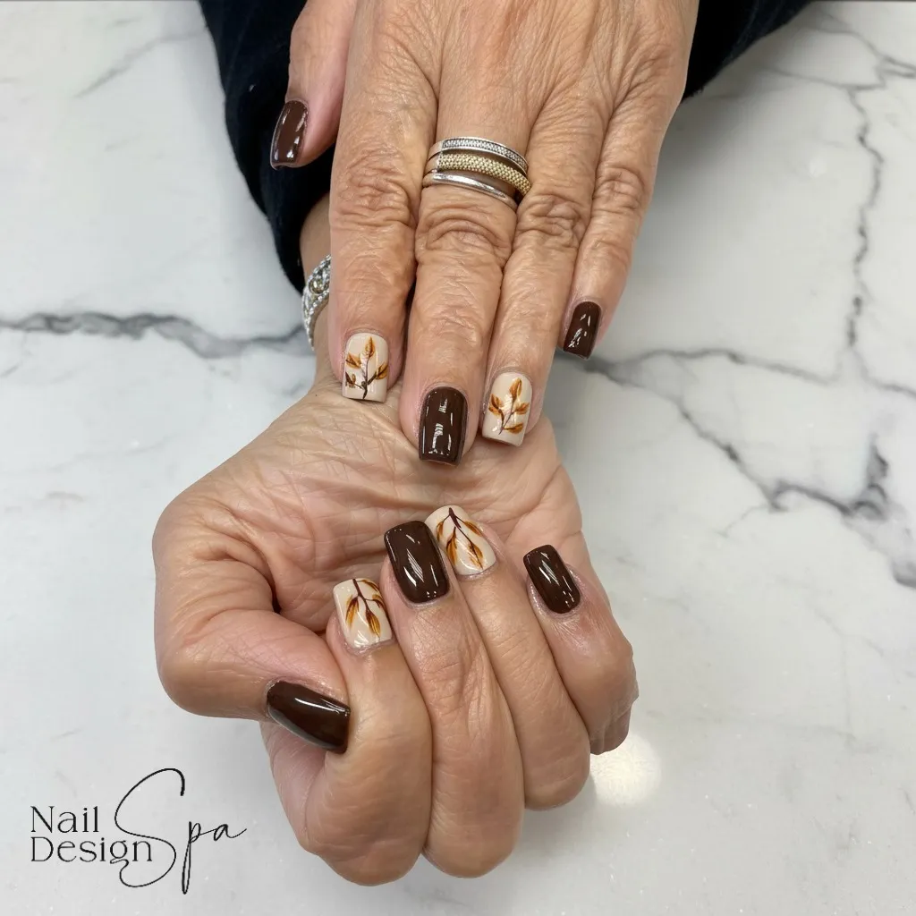 Dark brown solids with cream leaf-branch accents