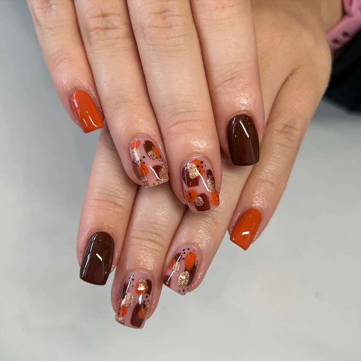 Burnt orange and deep brown with abstract glitter accents