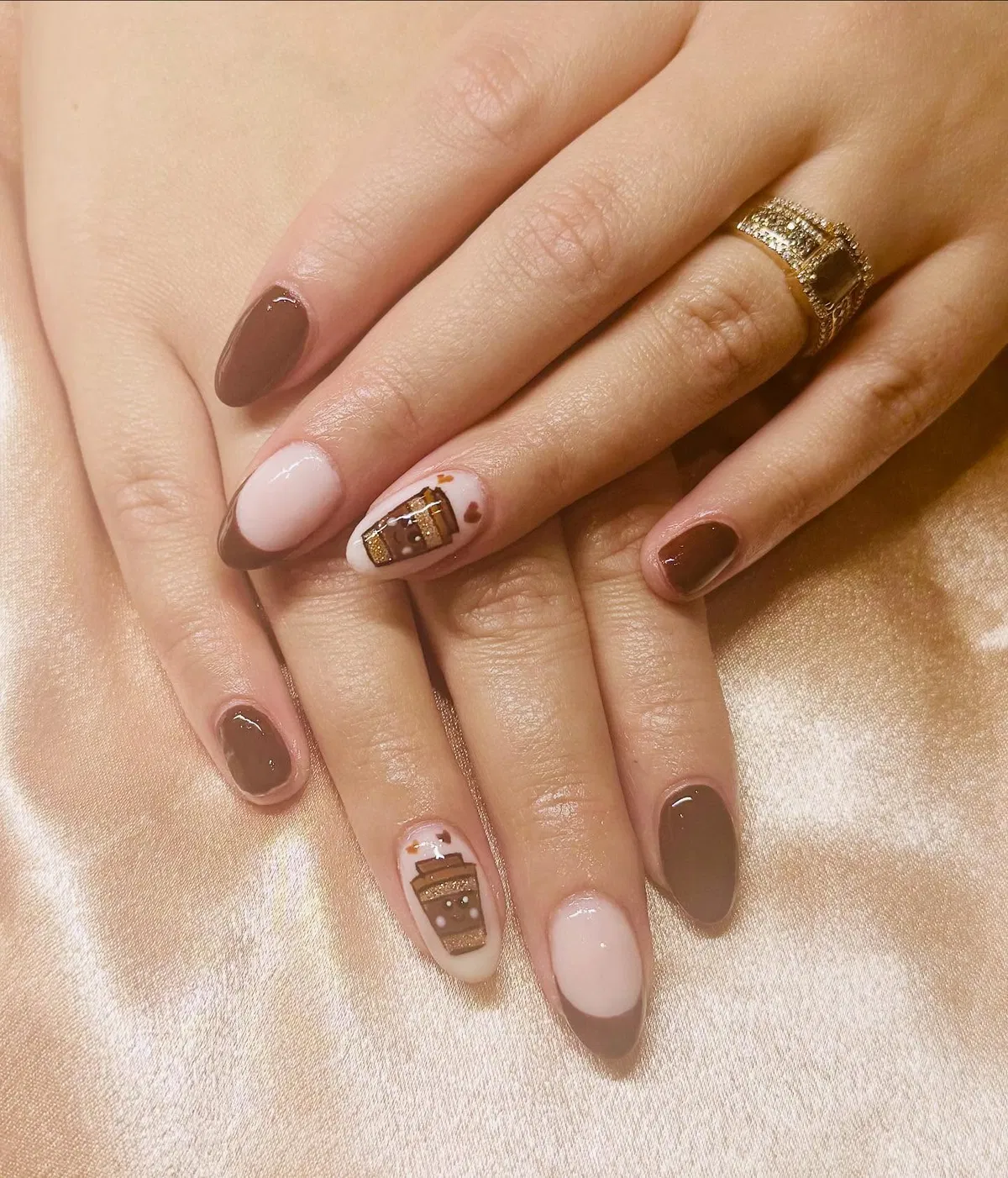 Brown French tips with cup illustration accents