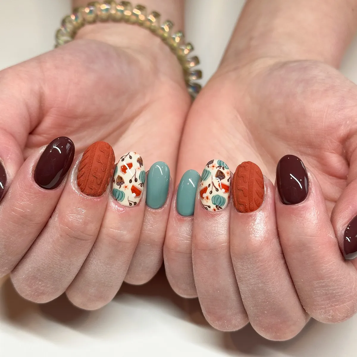 Burgundy and teal mix with textured rust pattern and pumpkin print