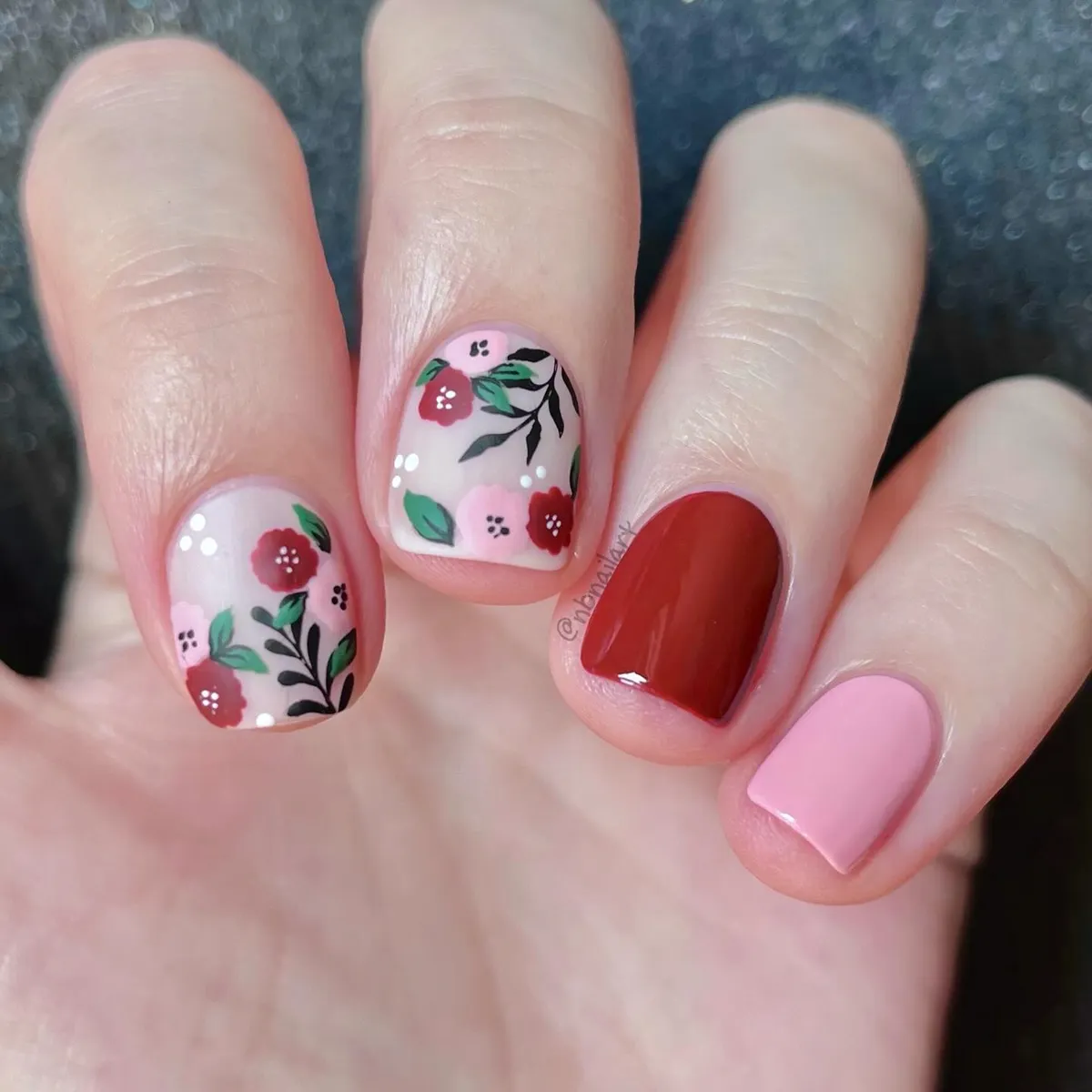 Floral accent nails with red and pink solids