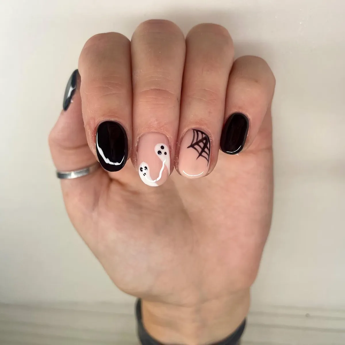 Short Black Nails with Minimal Ghost and Web Accents