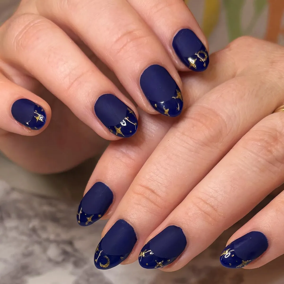 Matte navy with glossy tips and gold celestial accents