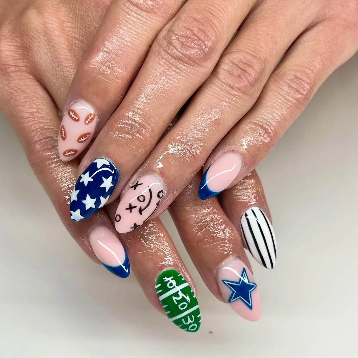 Mixed football set with blue tips, stars, and field markings