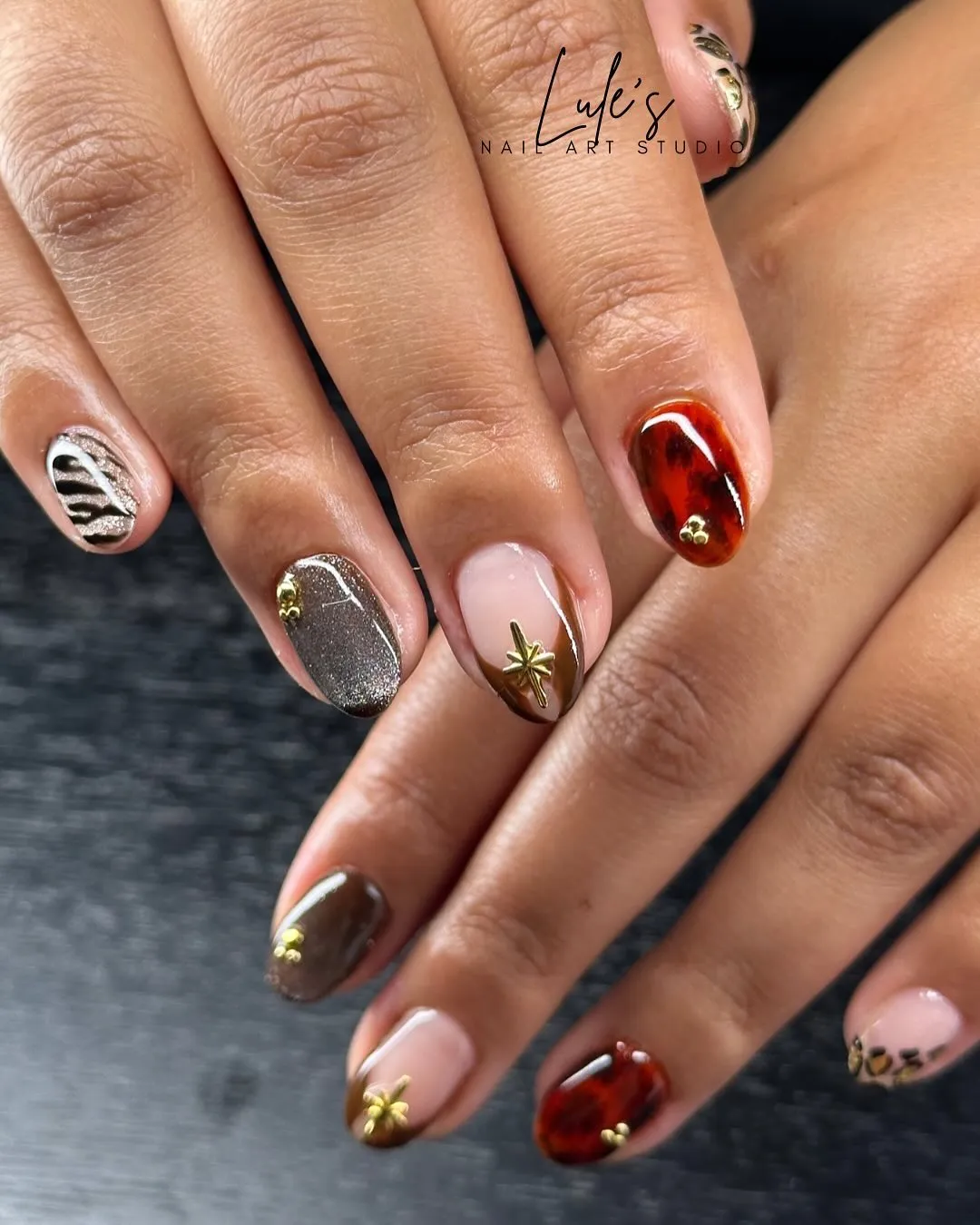 Brown tips with silver accents and gold charms